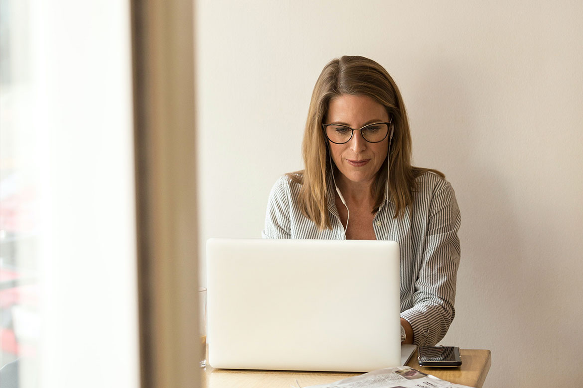 A senior finance professional approves an invoice for release to the company's financial system while traveling for work