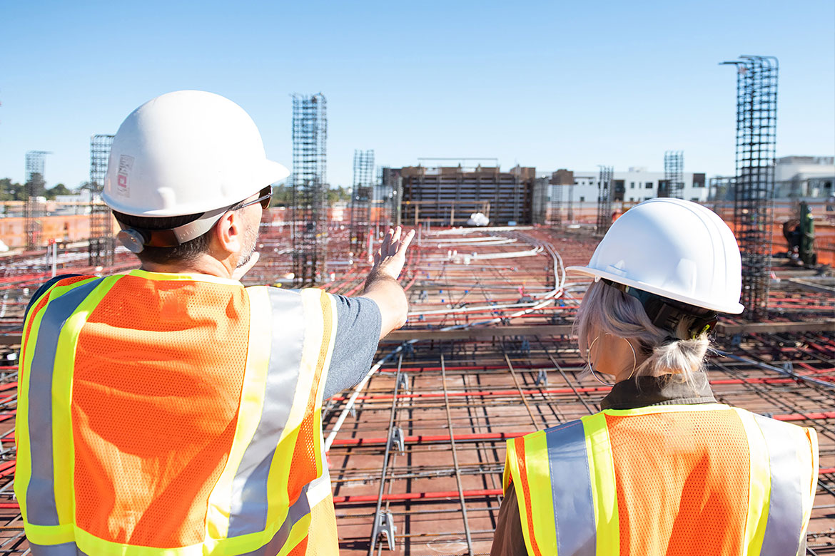 Two construction workers at a job site